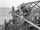Aspendale Technical School students build boat shed on beach, 1963. Working on roof John Raisbeck, John Paydon and Peter Borrodale. (Courtesy: Leader Collection, City of Kingston)